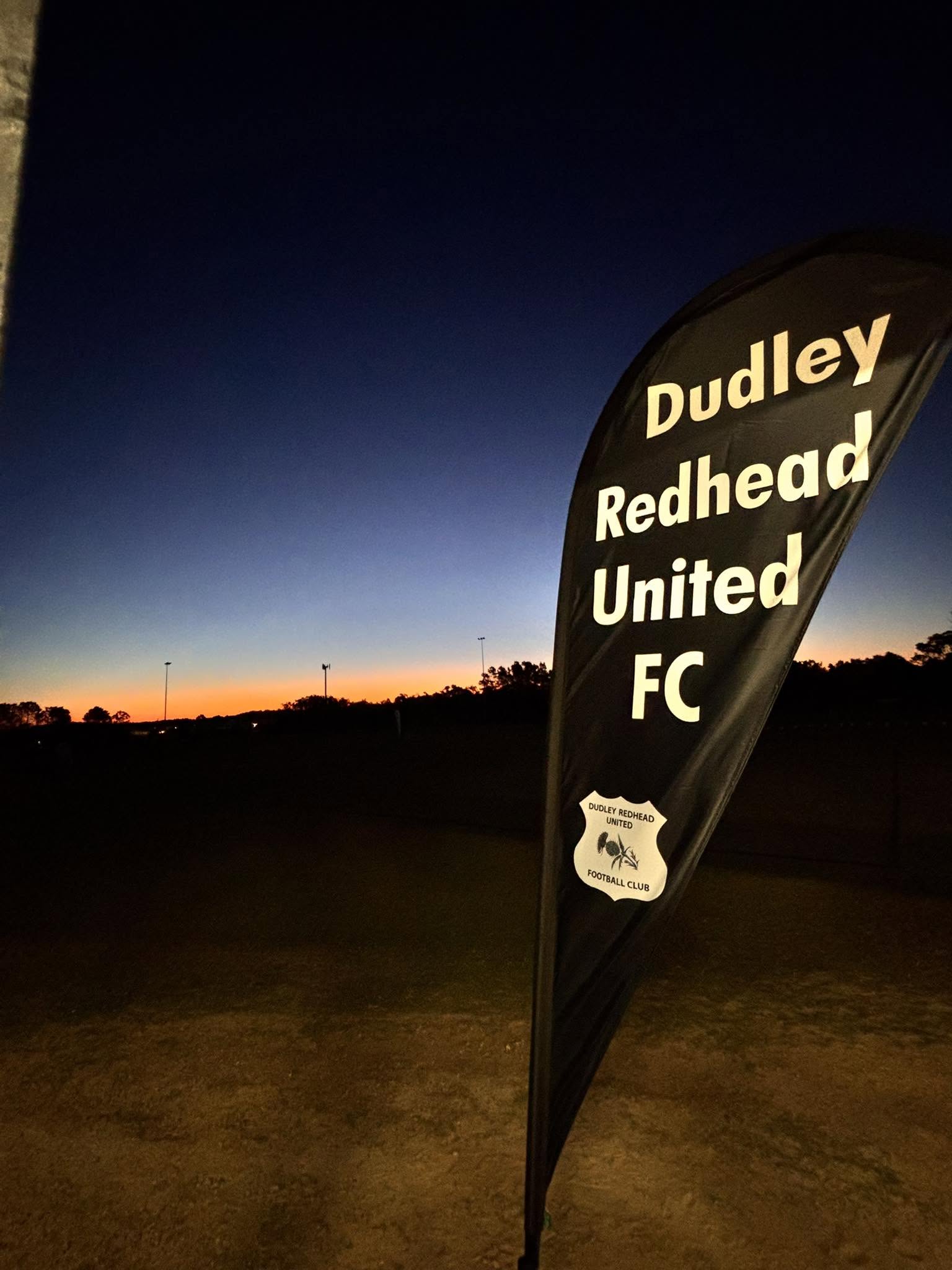 Dudley Redhead United FC banner at sunset at Liles Oval