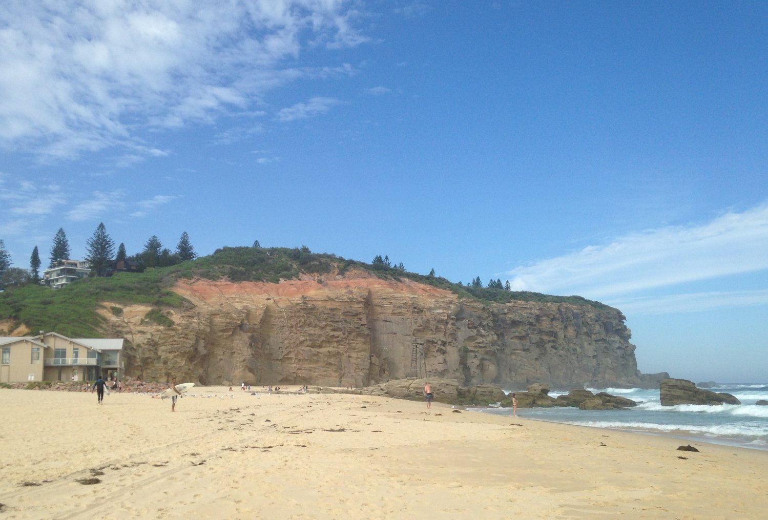 The red sandstone cliffs of Redhead Bluff seen from Redhead Beach