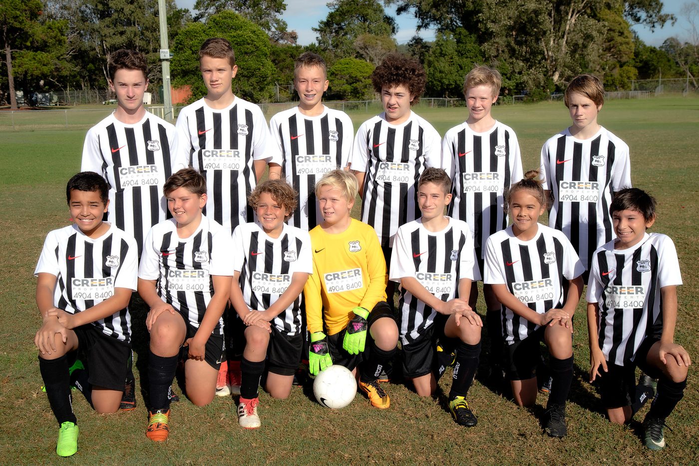 A Dudley Redhead United junior team together in the club's black-and-white stripes