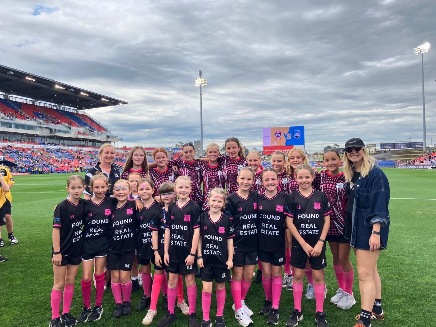 DRUFC girls on the pitch at a Newcastle Jets match